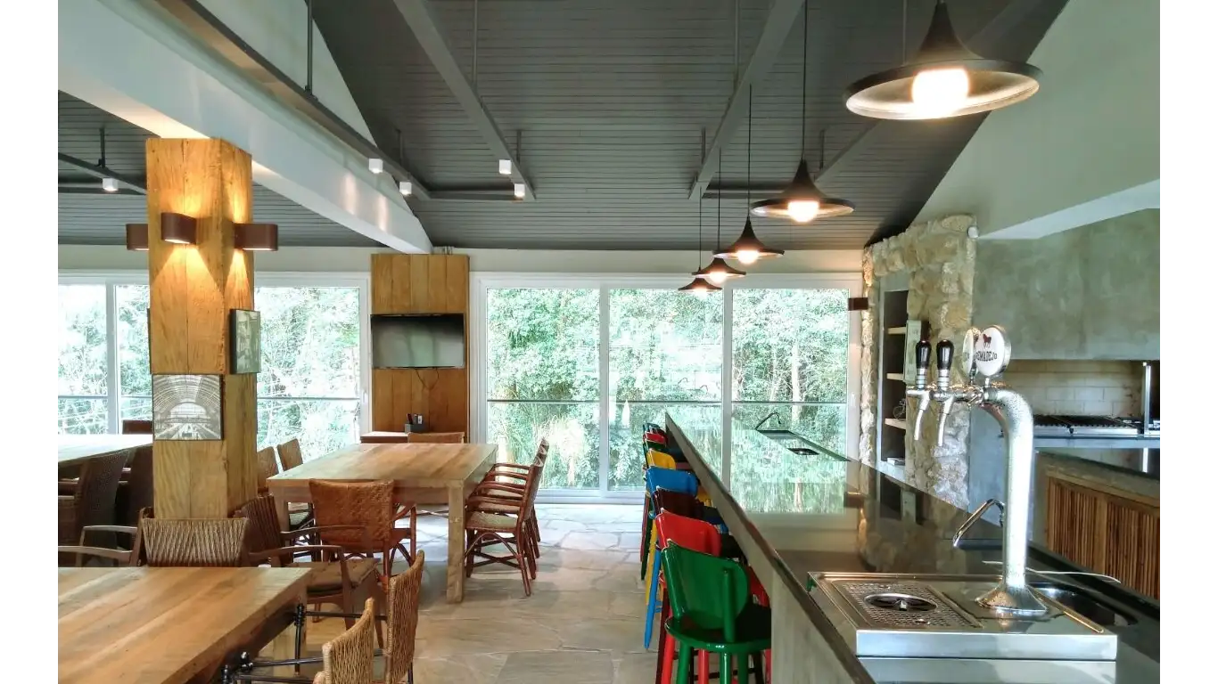 Affectionately called Galpão by the owners, it is located on a farm in the interior of São Paulo and serves as the leisure and recreation infrastructure of a sports complex on the property