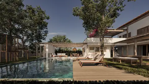 A two-story house in Mediterranean style, with a structure inspired by a small inn, where the entire social area and suites face a protected area, promoting privacy and integration with nature