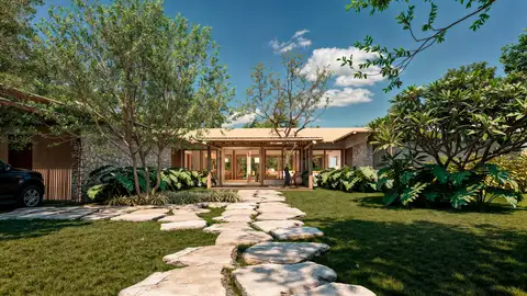 Casa Patí se extiende de forma natural a través de la amplia parcela de 2.500 metros cuadrados en Golfe do Outeiro, ocupándola de forma abierta y generosa